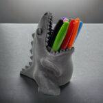 מעמד לעטים ועפרונות דינו